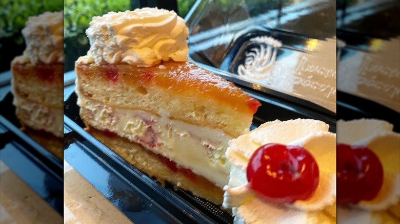 Close-up of a Cheesecake Factory pineapple upside-down cake in takeout container