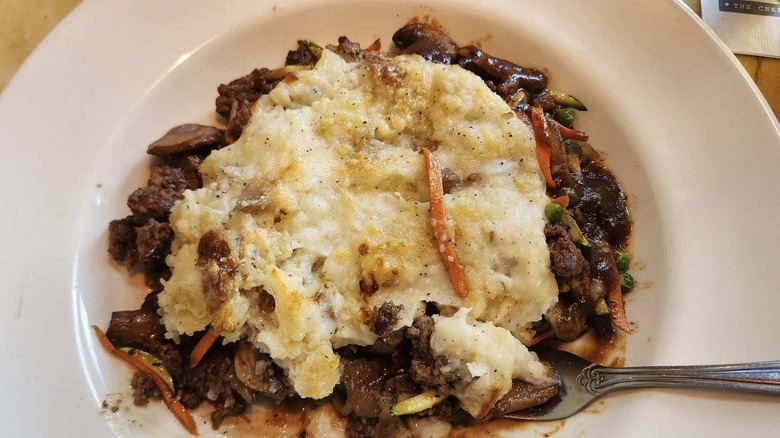 Overhead view of a plate of Cheesecake Factory Shepherd's pie with fork
