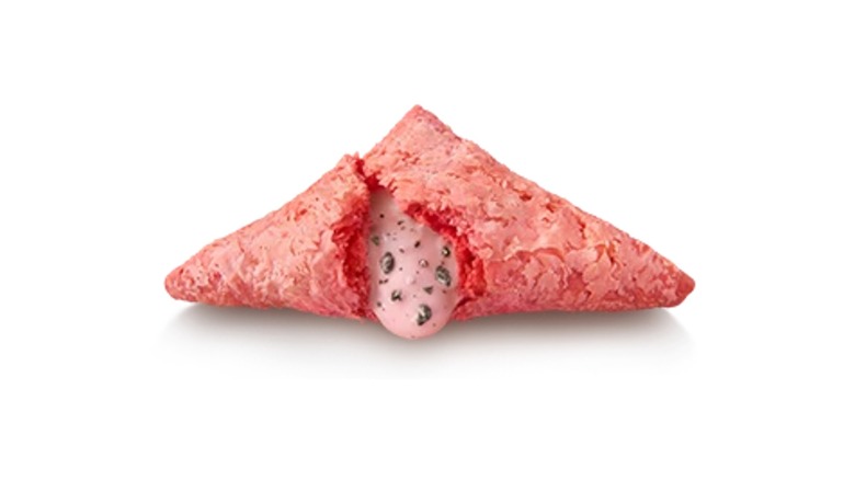 A Sankaku Choco Pie Cookie & Cream Strawberry opened with cream coming out against a white background