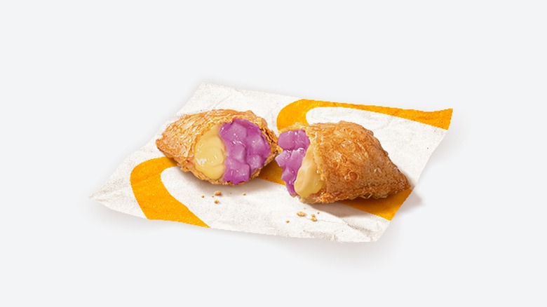 A split Taro Custard Pie against a white background