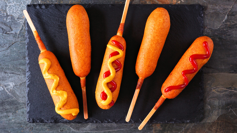 Corn dogs with various toppings