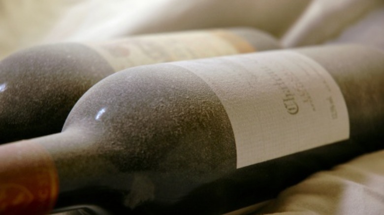 dusty bottle stored on side