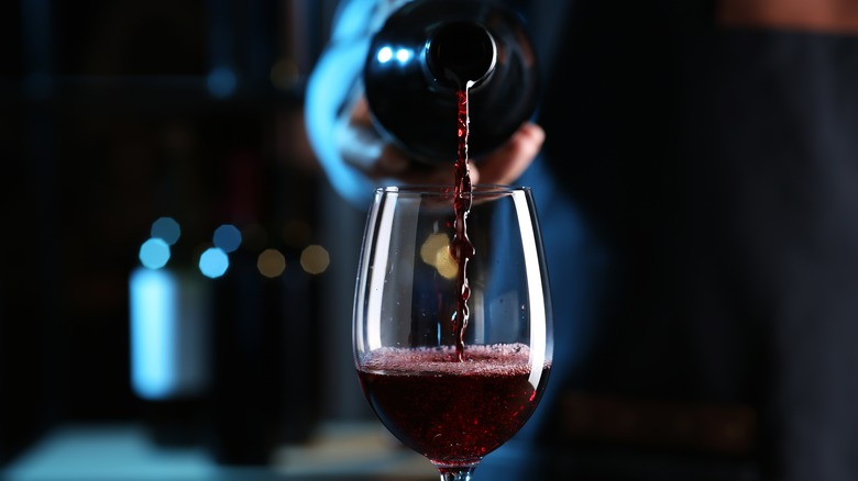 Red wine poured into glass