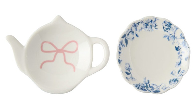 Two small decorated plates, one round and one shaped like a tea kettle