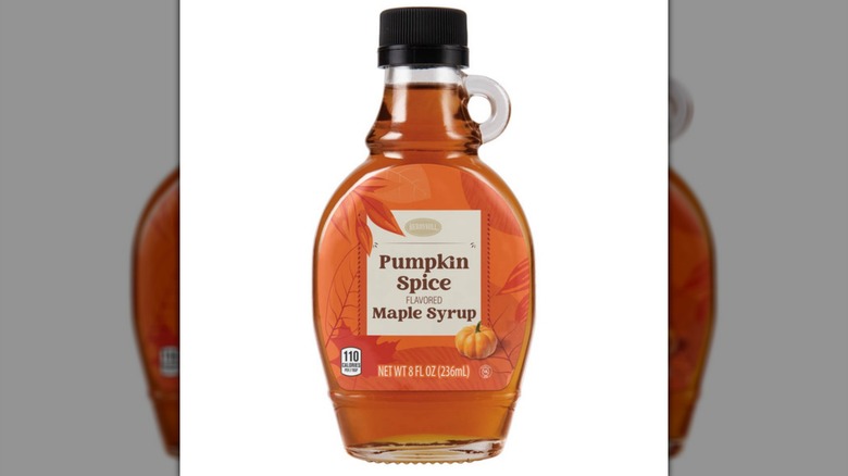 A bottle of Specially Selected Pumpkin Spice Maple Syrup on a white background
