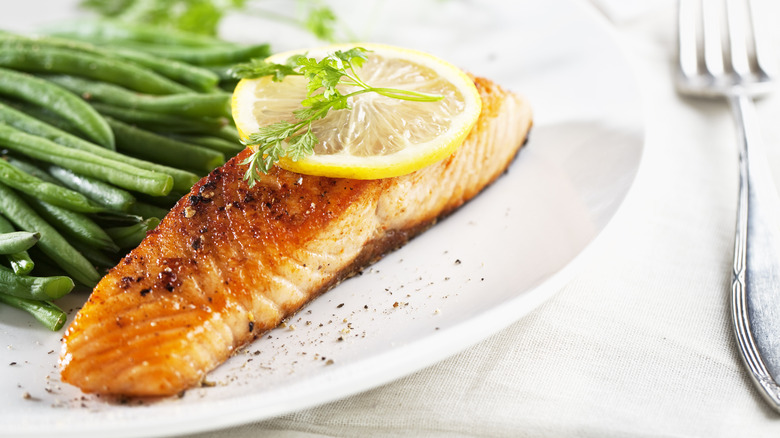 salmon and green beans on plate