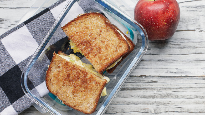 Egg salad sandwich in container