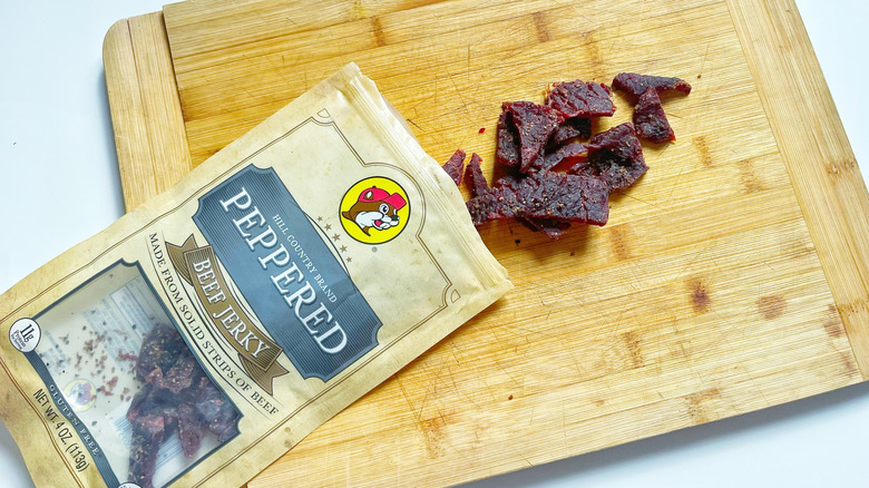 A bag of Hill Country Brand Peppered jerky spilling its contents