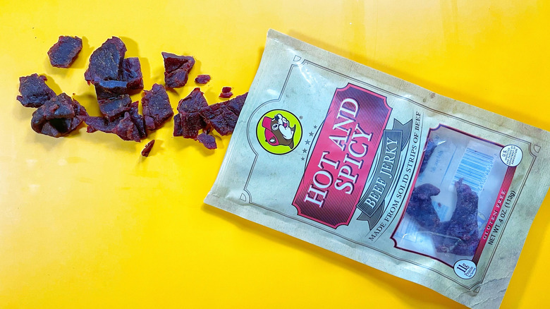 A bag of Hot And Spicy jerky spilling its contents
