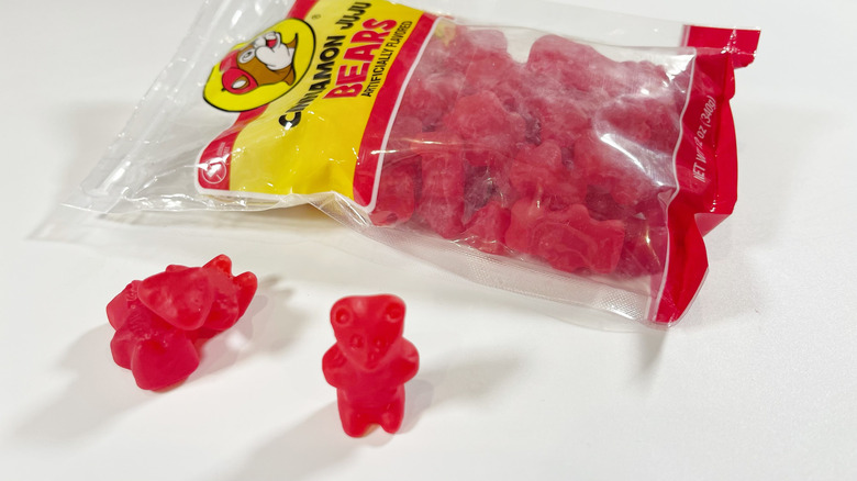 A bag of Cinnamon Juju Bears with a few candies set out
