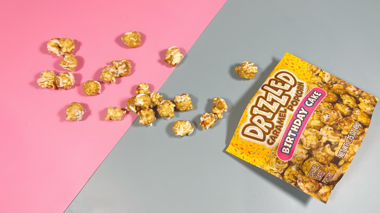 The bag of Drizzled caramel popcorn with contents spilling out