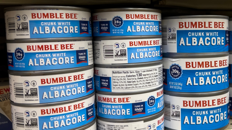 Cans of Bumble Bee chunk white tuna on a store shelf
