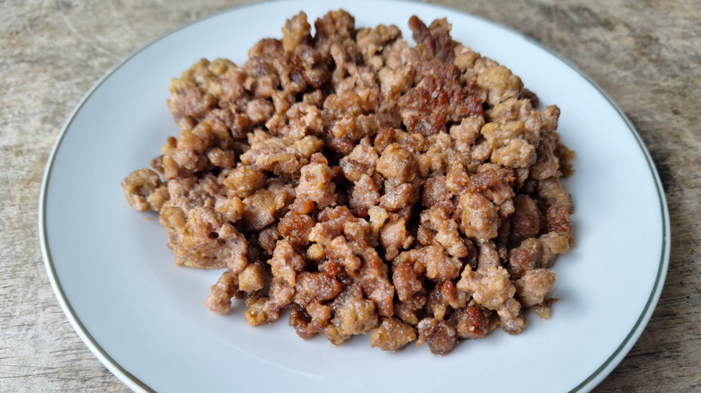 A pile of ground beef on a white plate