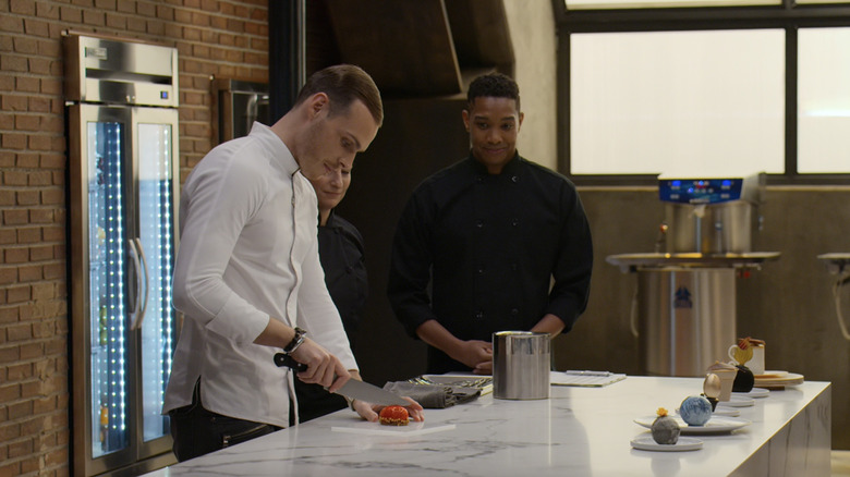 Guichon cuts through chocolate piece on School of Chocolate