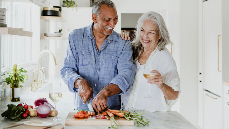 Couple enjoying joyful cooking