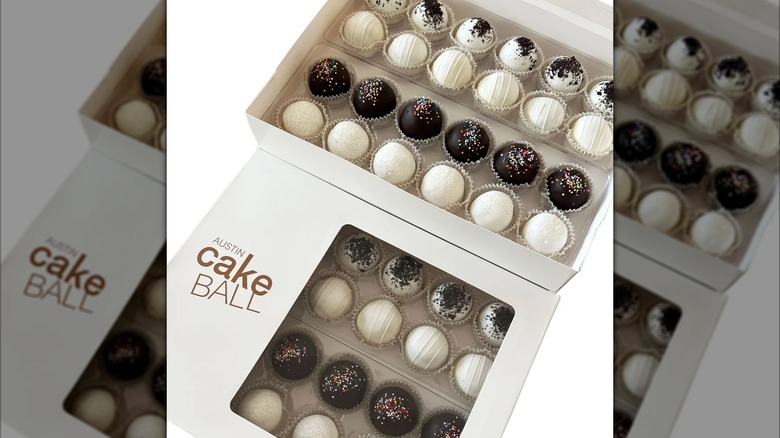 48 assorted cake balls, visually resembling elaborate chocolate truffles
