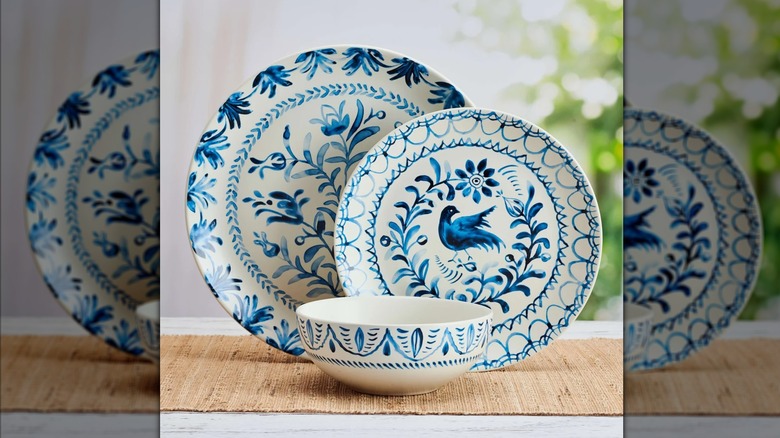 Blue and white dinnerware with plants and birds