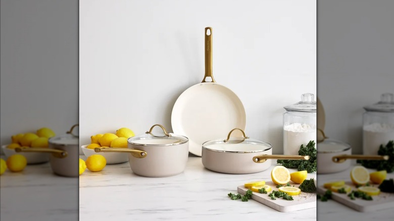 Cream-colored 5 piece cookware set with gold accents and lemons