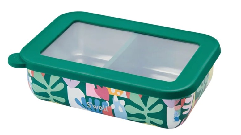 A forest green bento box with abstract floral patterns