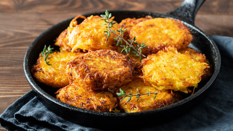 Latkes and thyme in a skillet