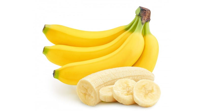 Bunch of banana and peeled bananas