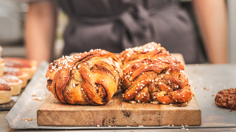 Swedish cinnamon rolls on wooden block