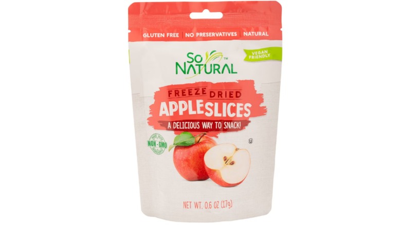 So Natural Freeze Dried Apple Slices at Dollar Tree in a red and beige bag against a white background.