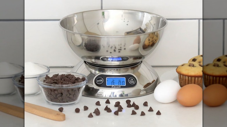 Escali Rondo Kitchen Scale next to muffins, eggs, and chocolate chips