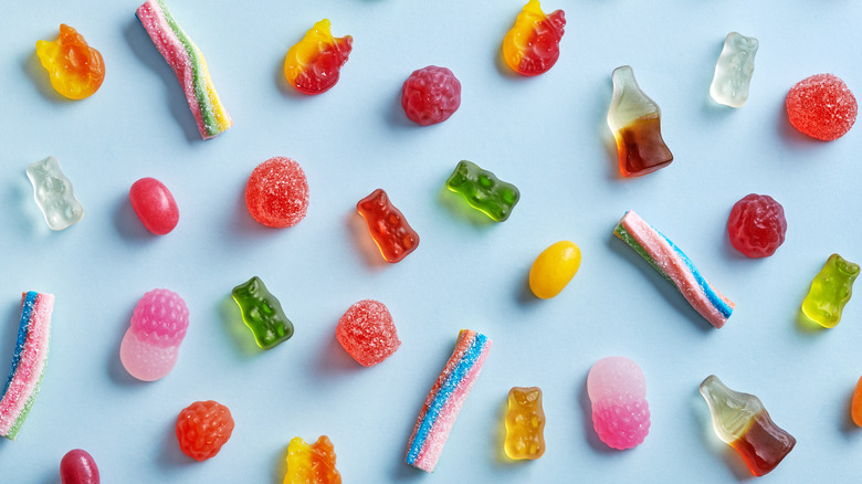Various gummies on blue background