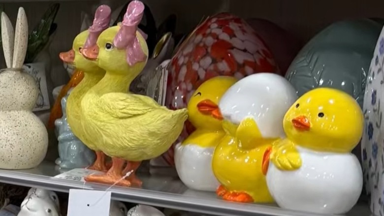 Various duck figurines on HomeGoods shelf.