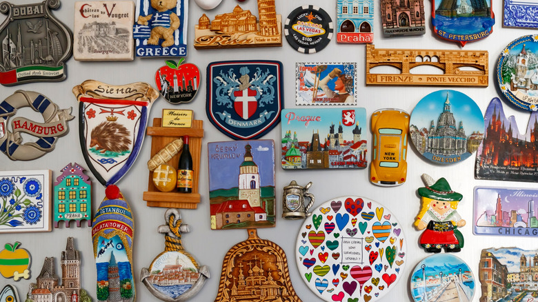 A refrigerator cluttered with various magnets