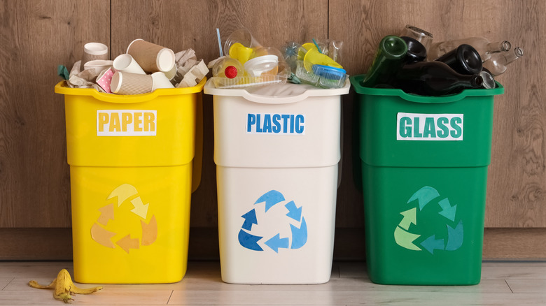 recycling bins lined up in front of wall oven