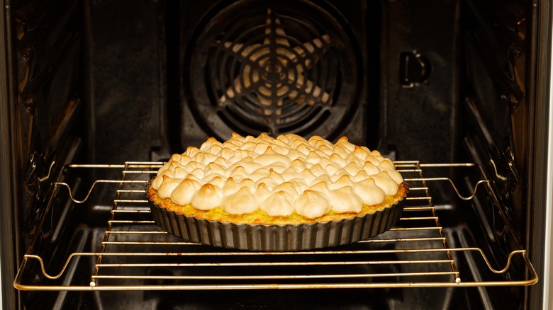 Lemon meringue pie in oven