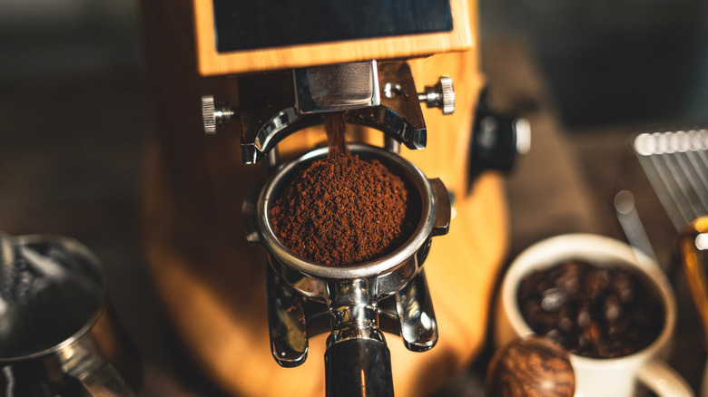 home espresso machine with ground beans in portafilter