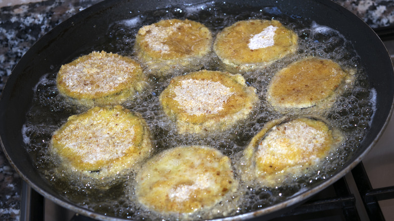 Slice of eggplant in skillet