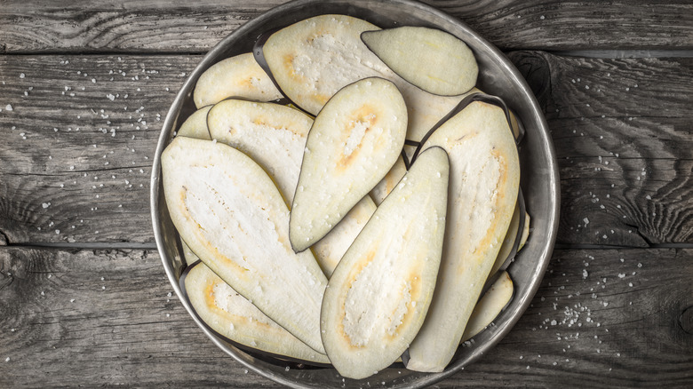 Salted eggplant on metal plate