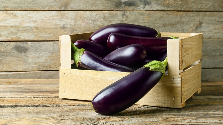 Eggplants in wood crate