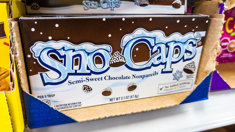 Packages of Nestlé Sno-Caps are seen on a supermarket shelf