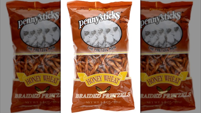 A package of Pennysticks Brand Honey Wheat Braided Pretzels, seen on a white background