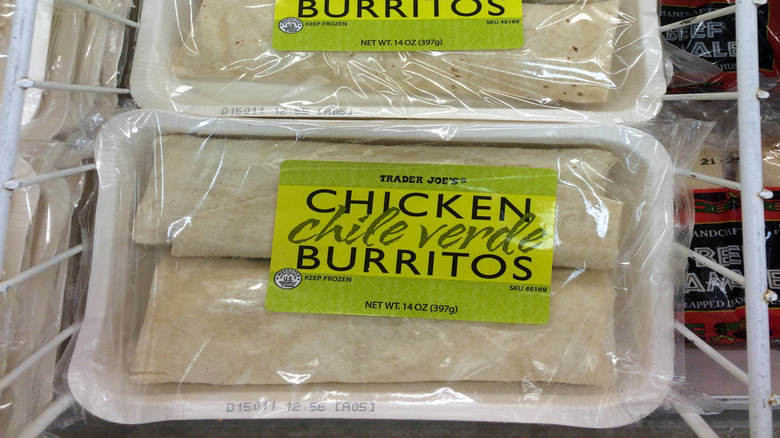 An image of Trader Joe's packaged chicken burritos in a freezer.