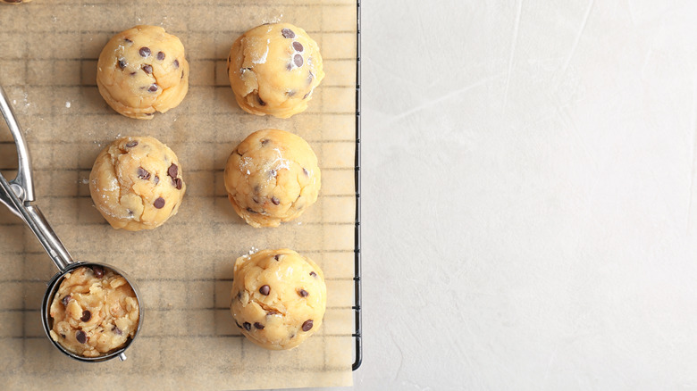 Scooping chocolate chip cookie dough