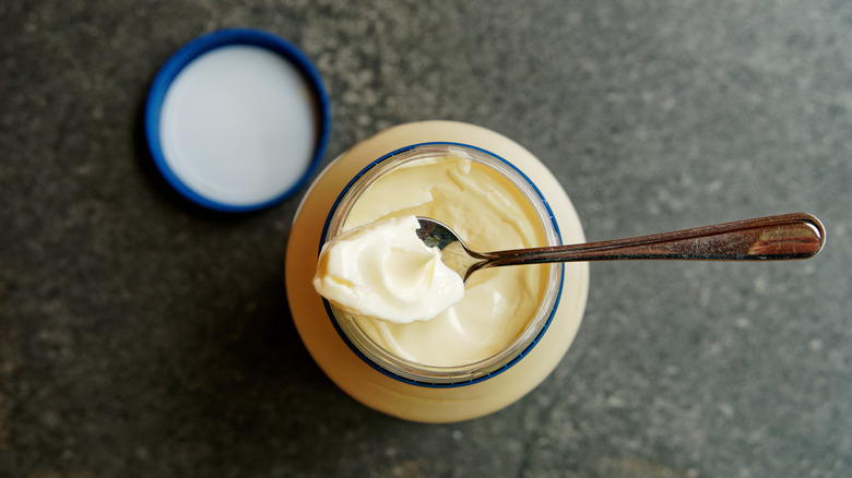 new mayonnaise jar with spoon