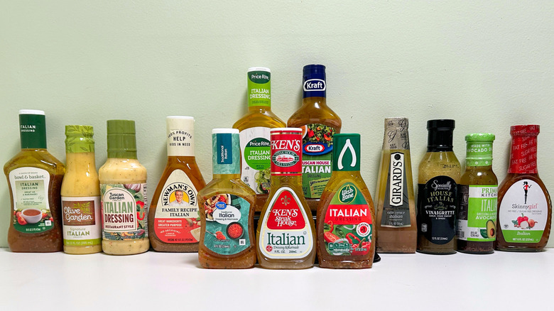 Several bottles of store-bought Italian dressings in two rows