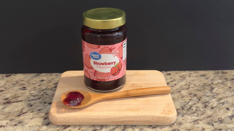 Jar of Great Value strawberry preserves with sample on spoon