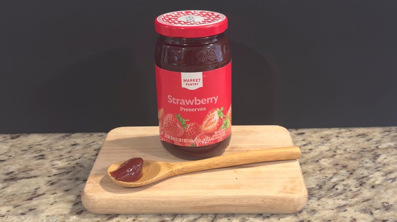 Jar of Market Pantry Strawberry Preserves with sample on spoon