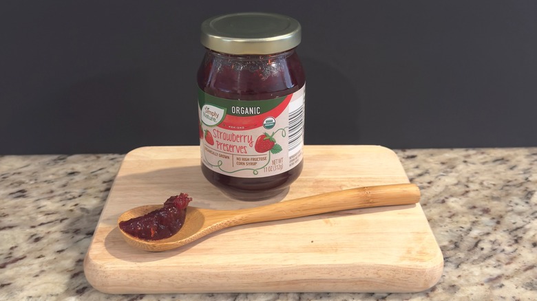 Jar of Simply Nature Strawberry Preserves with sample on spoon
