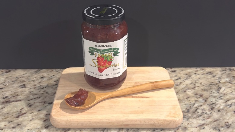 Jar of Trader Joe's Strawberry Preserves with sample on spoon