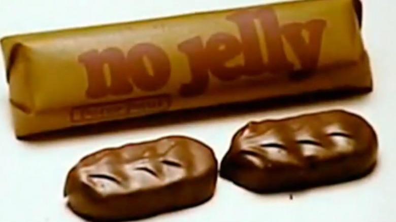 A vintage ad for No Jelly bars featuring a wrapped candy package and two open candies on a white background