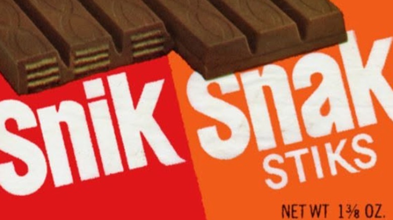 An old print ad for Snik Snak Stiks featuring an unwrapped bar and logo