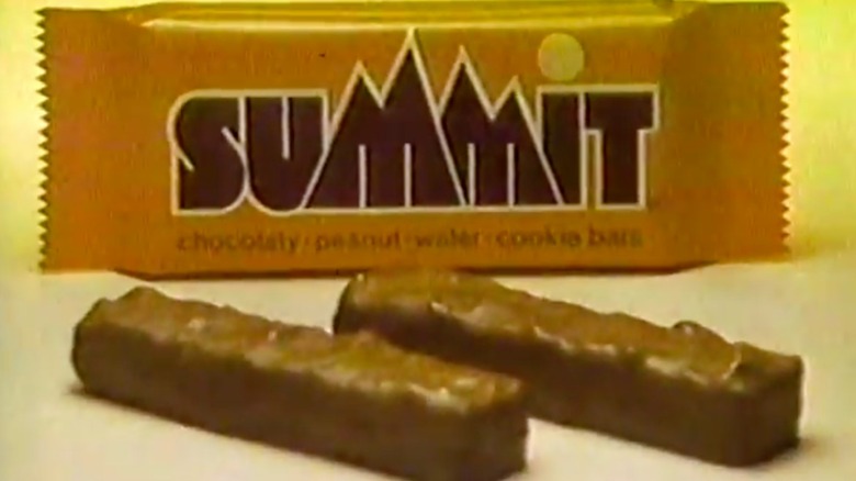 A still from a vintage TV ad for Summit Bars featuring two unwrapped bars and a wrapped one